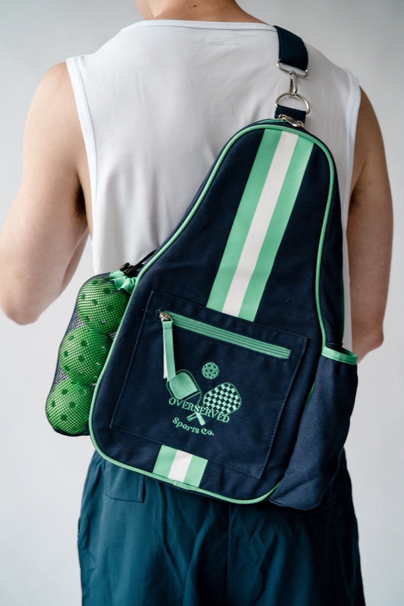 Load image into Gallery viewer, Overserved PIckleball Canvas Sling on a man's back Navy / Green
