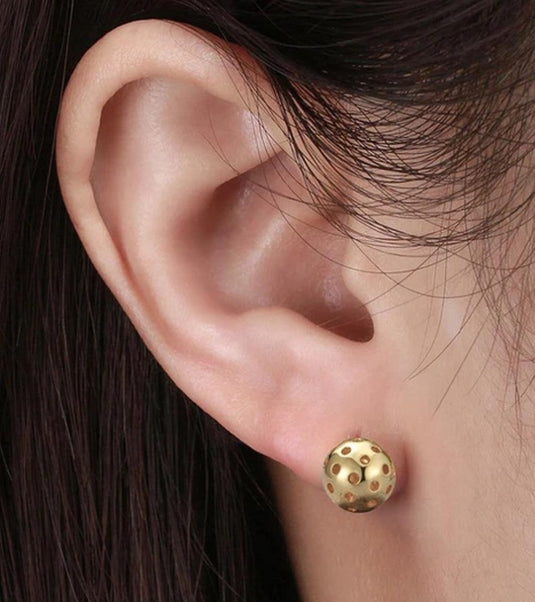Picklebelle Gold Stud Earrings on an ear