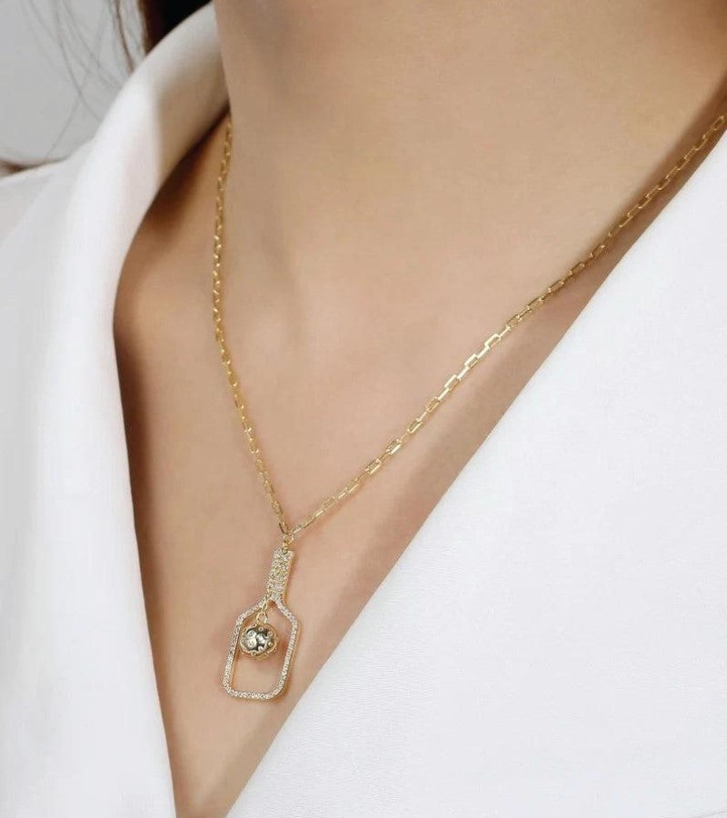 Load image into Gallery viewer, The Volley Plus Pickleball Necklace Gold on a neck
