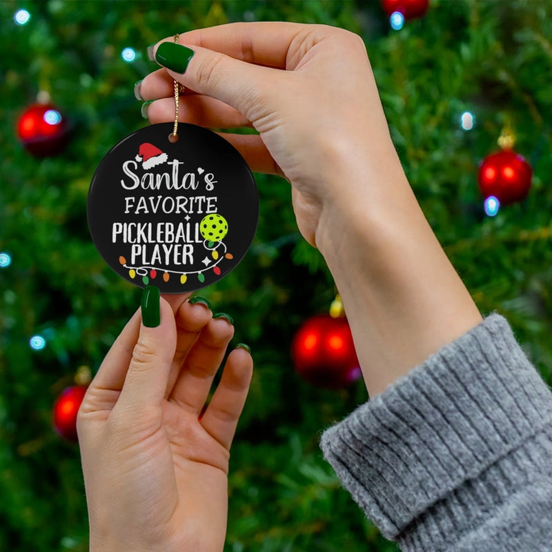 Load image into Gallery viewer, Santa's Favorite Pickleball Player Disc Ornament next to tree
